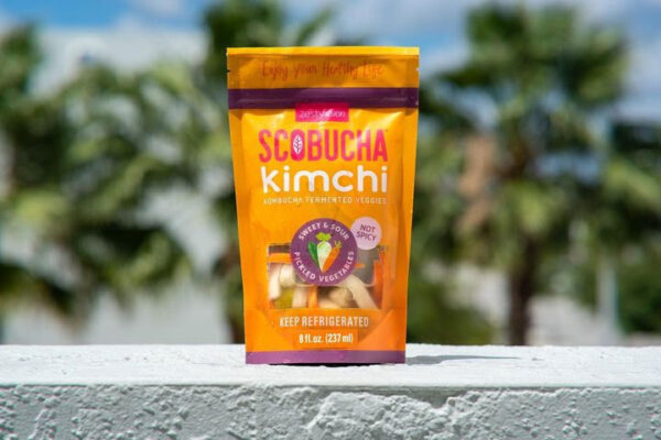 A bag of scobucha kimchi sitting on top of a ledge.